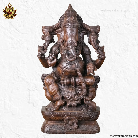 Handcrafted Wooden Ganesha Statue in Traditional Temple Setting