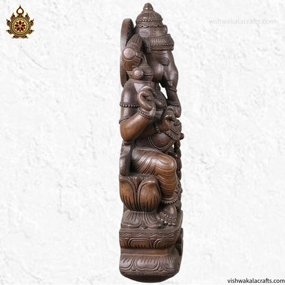Handcrafted Wooden Ganesha Statue in Traditional Temple Setting