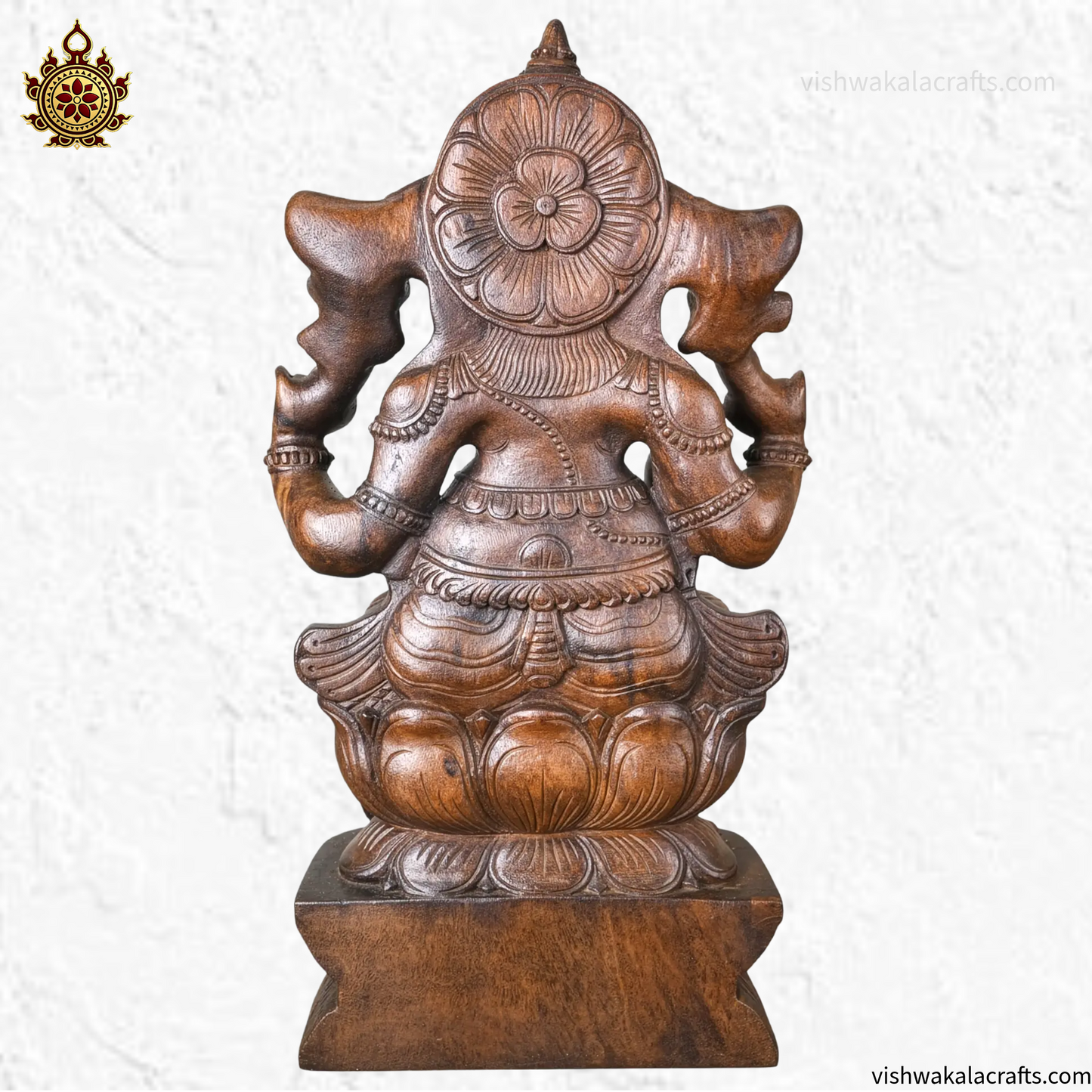 Handcrafted Wooden Ganesha Statue in Traditional Temple Setting