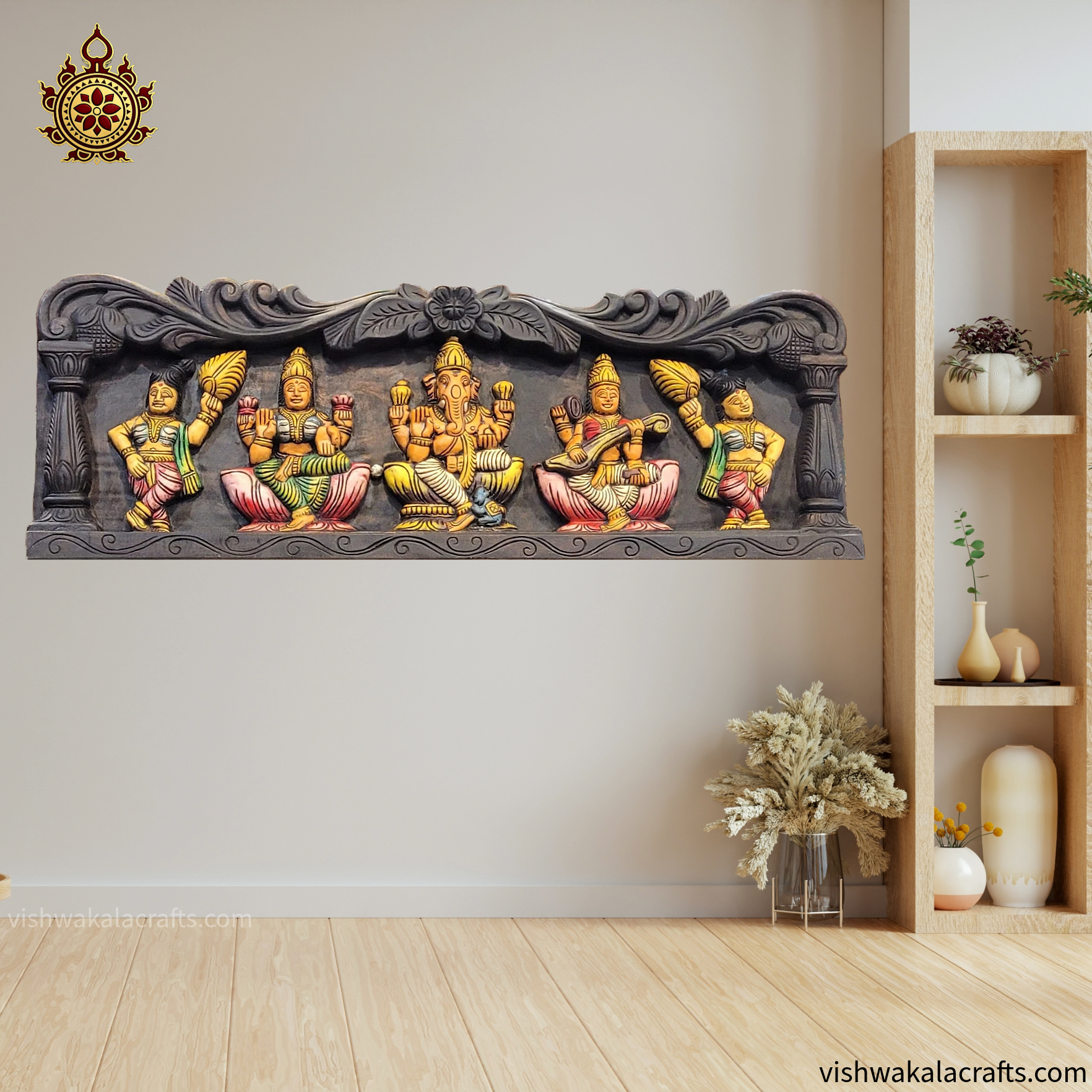 Decorative wall art with colorful figures on a plain wall with a wooden shelf.
